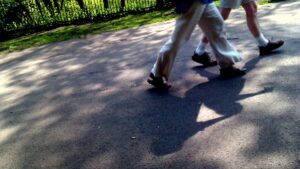 People walking in park (only legs visible)