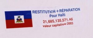 Sticker demanding reparations for Haiti (valued 2003 at 21,685,135,571.48 USD)